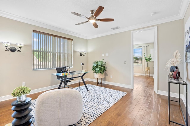 office with crown molding, hardwood / wood-style flooring, and ceiling fan