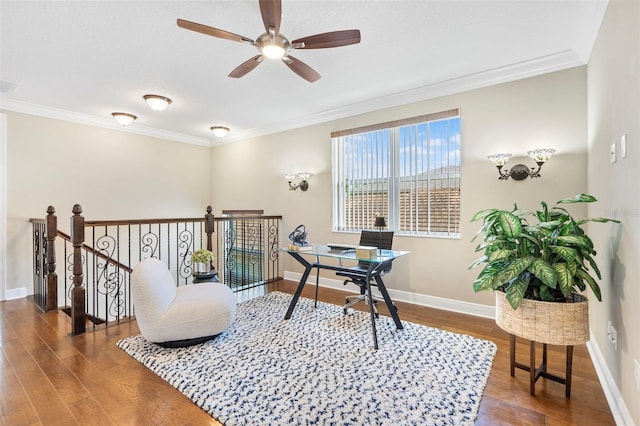 office area with dark hardwood / wood-style flooring, ornamental molding, and ceiling fan