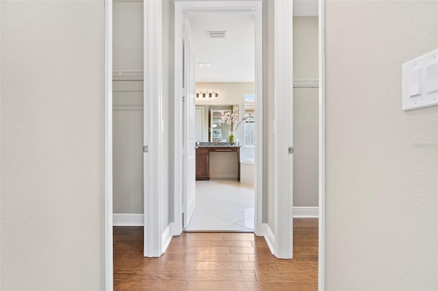 hallway featuring hardwood / wood-style flooring