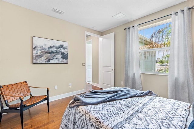 bedroom with wood-type flooring