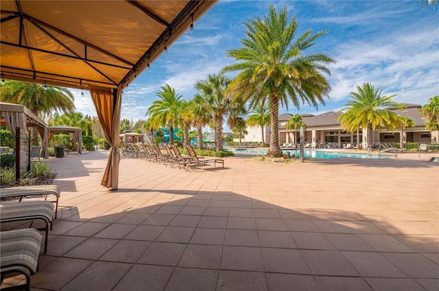 view of patio / terrace with a gazebo and a community pool