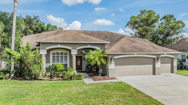 view of front facade with a garage and a front yard