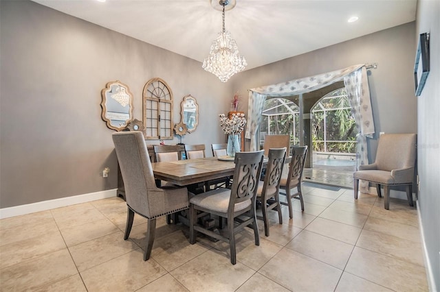 tiled dining area with a chandelier