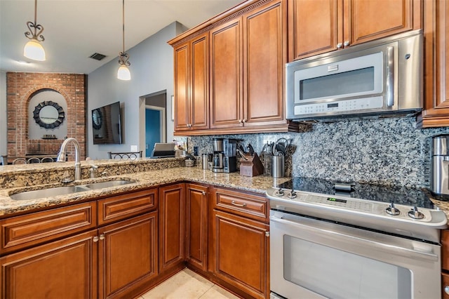 kitchen featuring brick wall, electric stove, backsplash, and light tile patterned floors