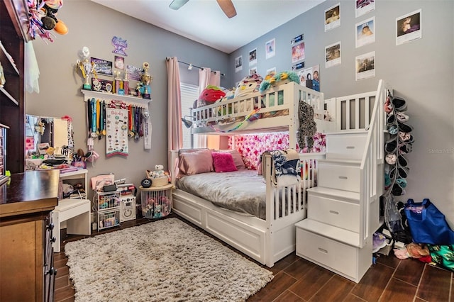 bedroom with ceiling fan and dark hardwood / wood-style flooring