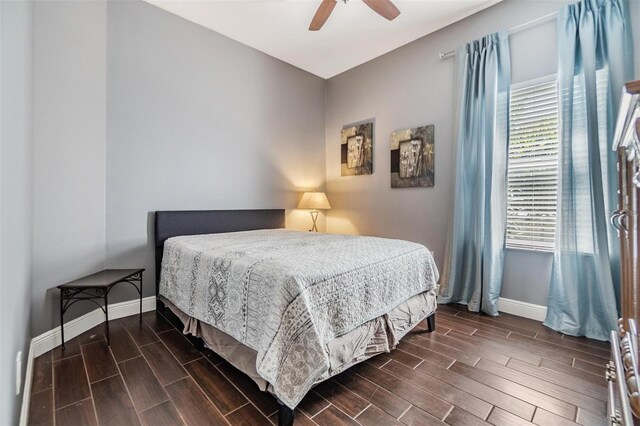 bedroom featuring dark hardwood / wood-style flooring and ceiling fan