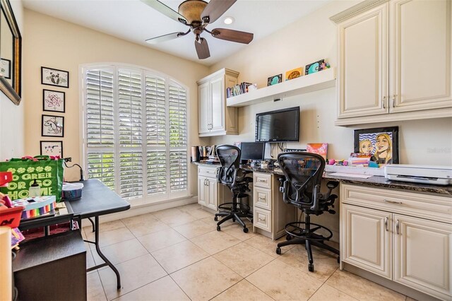 tiled office featuring ceiling fan