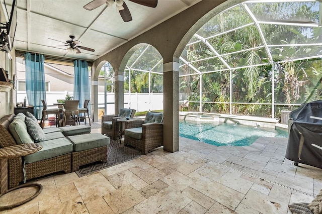 view of pool featuring a patio area, an outdoor hangout area, ceiling fan, and glass enclosure