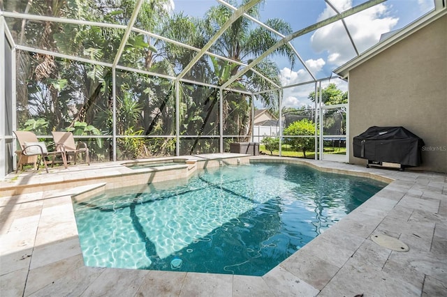 view of pool with a patio, an in ground hot tub, a grill, and glass enclosure