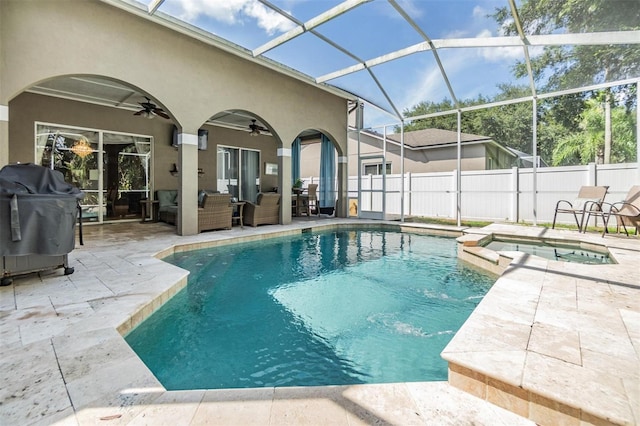 view of swimming pool featuring a patio, glass enclosure, grilling area, ceiling fan, and an in ground hot tub