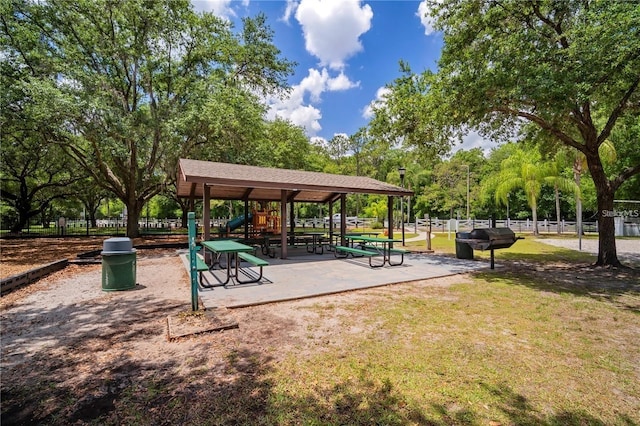 view of community with a lawn and a playground