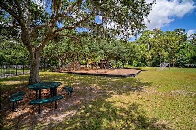 surrounding community with a playground and a lawn