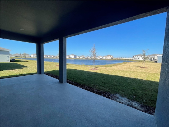 view of patio featuring a water view