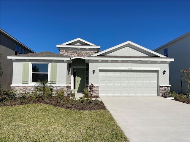 single story home with a front yard and a garage