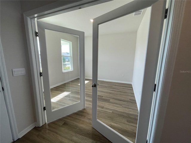 18207 Fattoria Ter, Lakewood Ranch, FL 34211 - corridor with dark wood finished floors and baseboards