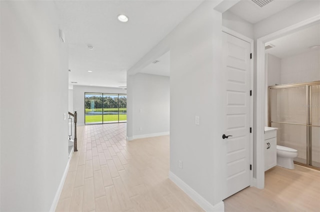 corridor featuring light wood-type flooring