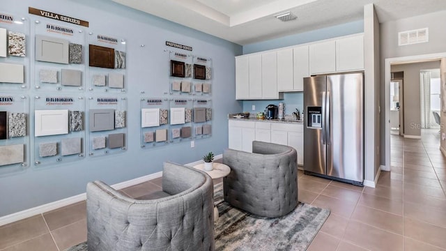 living area featuring tile patterned floors