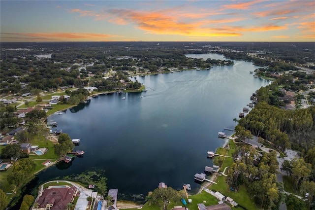 aerial view at dusk with a water view