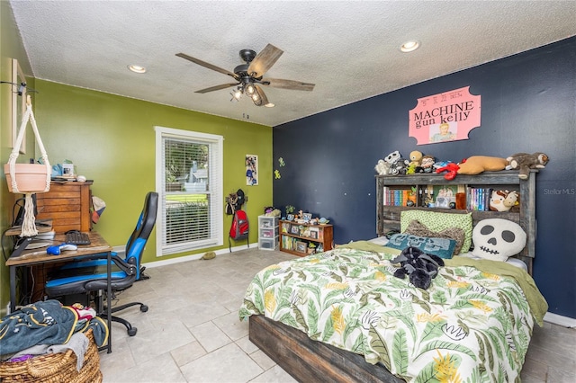 bedroom featuring light tile patterned floors, a textured ceiling, and ceiling fan