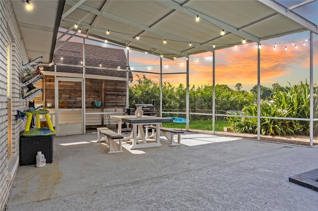 patio terrace at dusk with glass enclosure