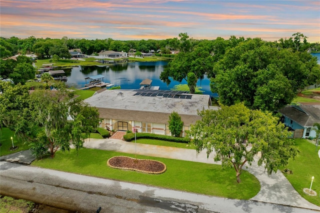 aerial view at dusk with a water view