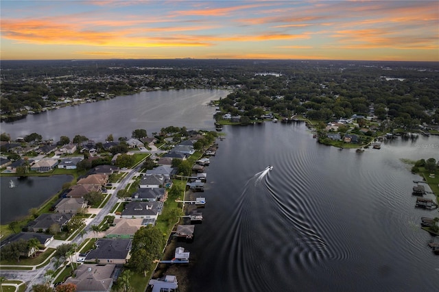 aerial view at dusk with a water view