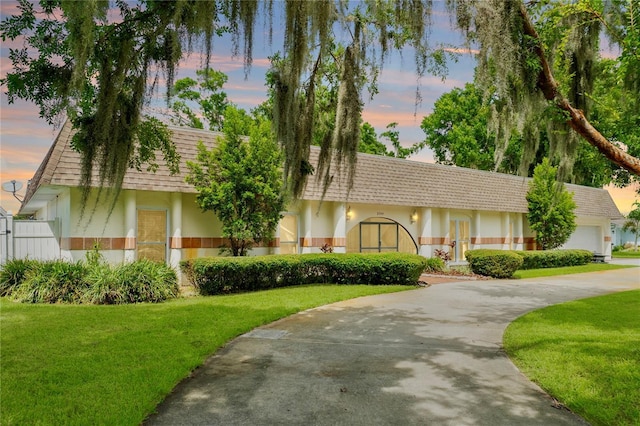 view of front of house with a yard