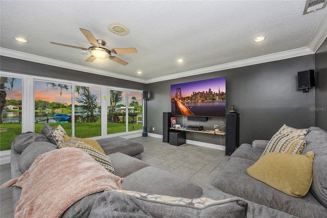 tiled living room featuring a textured ceiling, ceiling fan, and crown molding