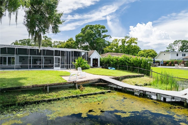 back of property with fence and a yard