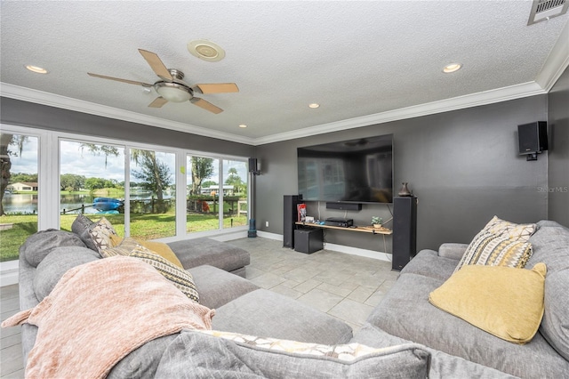 living area with crown molding, stone tile flooring, visible vents, a textured ceiling, and baseboards