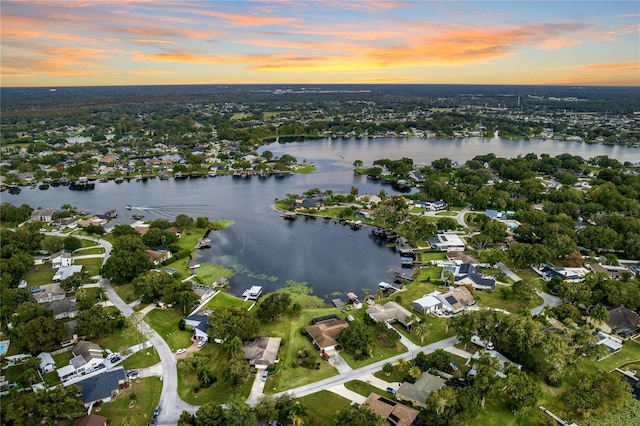 drone / aerial view with a residential view and a water view