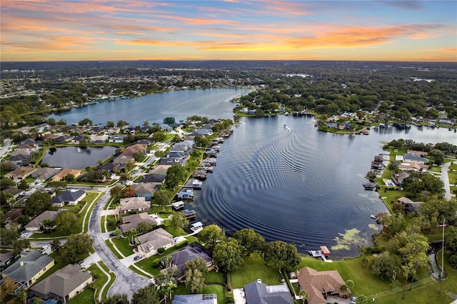 aerial view with a residential view and a water view