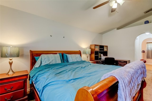 bedroom featuring lofted ceiling, ceiling fan, and light colored carpet