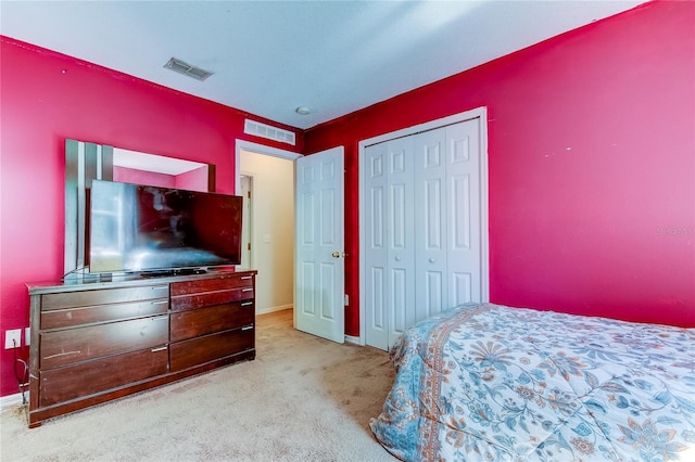 carpeted bedroom with a closet