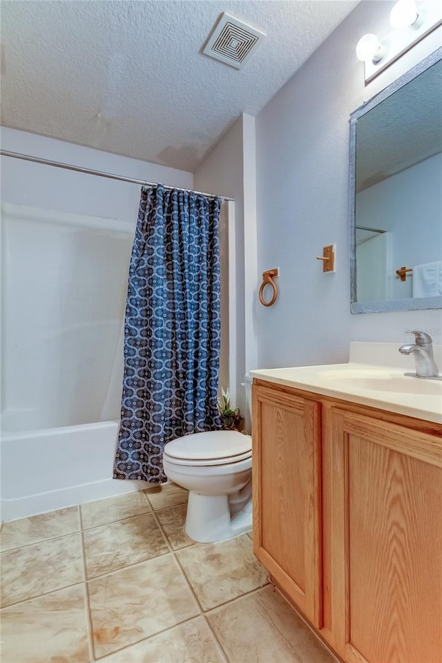 full bathroom with toilet, tile patterned flooring, vanity, a textured ceiling, and shower / tub combo