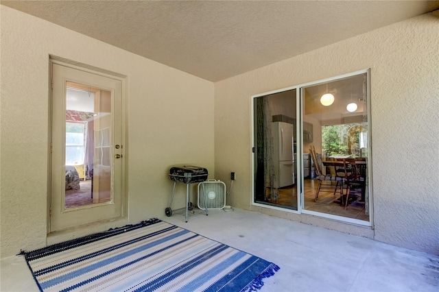 unfurnished bedroom with a textured ceiling and a closet