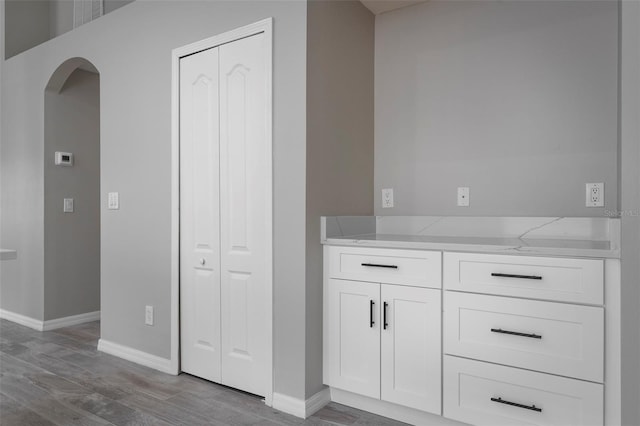 bathroom with wood-type flooring