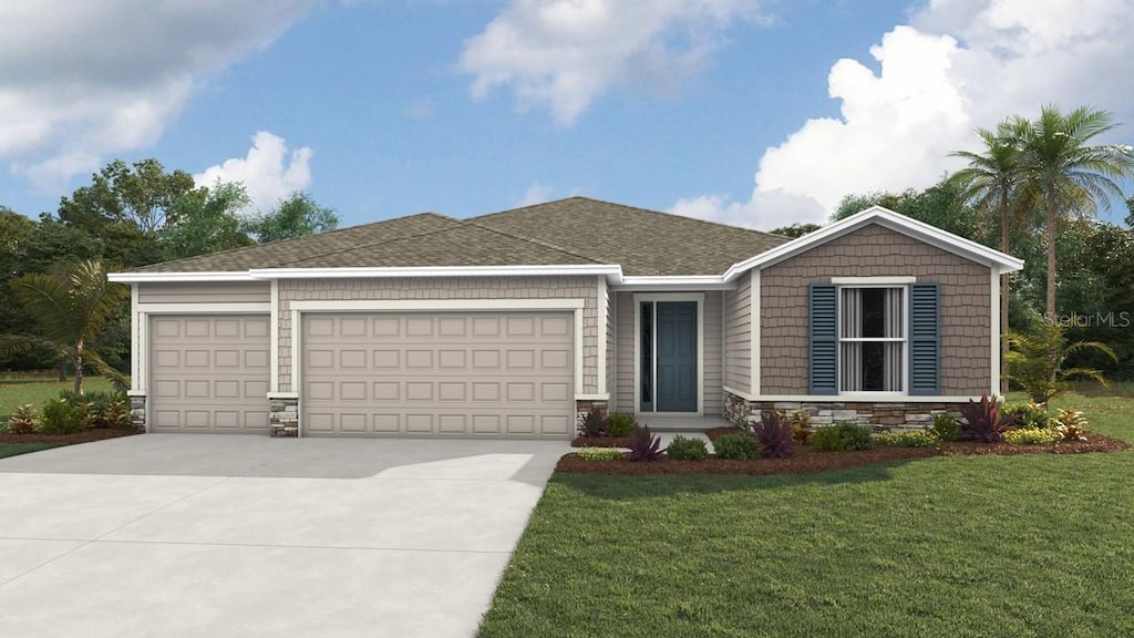 view of front facade with a garage and a front yard