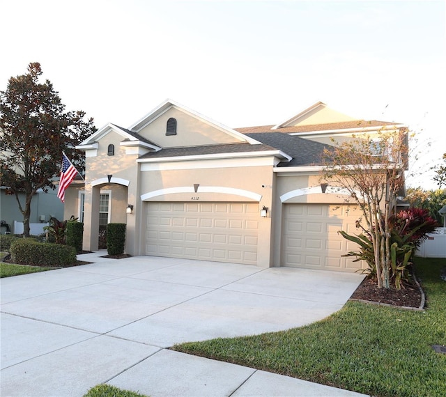 ranch-style home featuring a garage