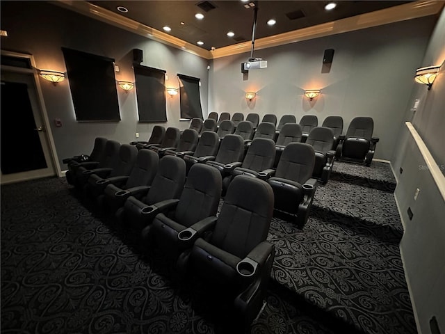 home theater featuring dark colored carpet and ornamental molding