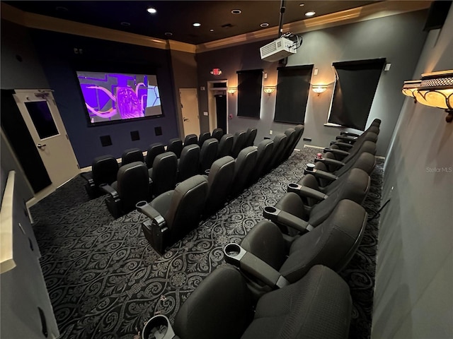 cinema room featuring carpet floors and crown molding