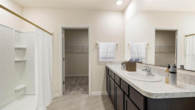 bathroom with tile patterned flooring, vanity, and a shower with shower curtain