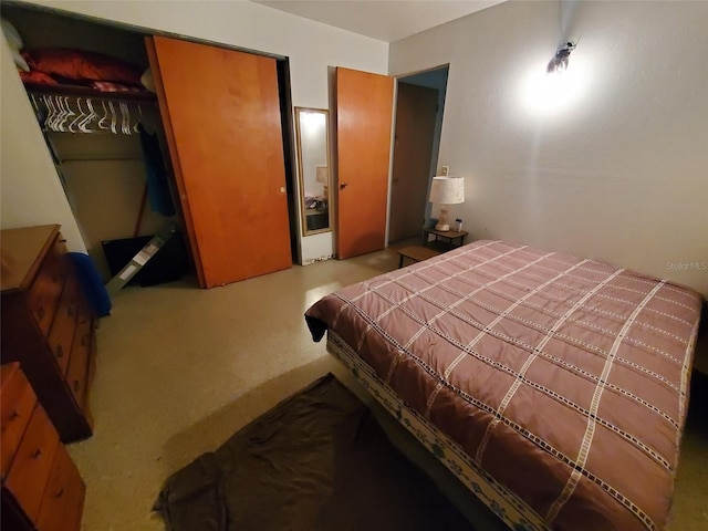 bedroom featuring a closet and carpet flooring