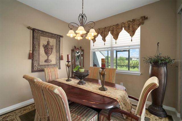 dining space with an inviting chandelier