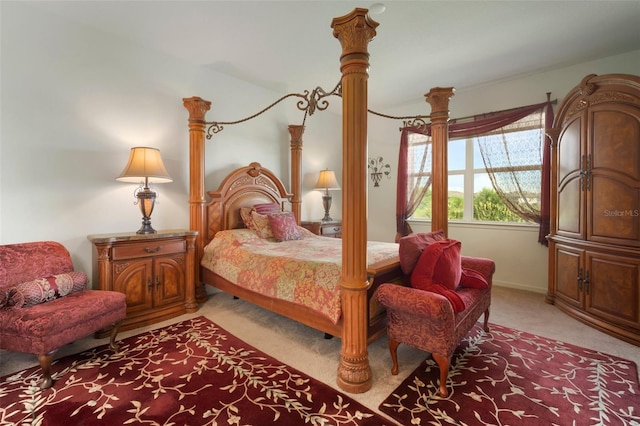 bedroom featuring light colored carpet