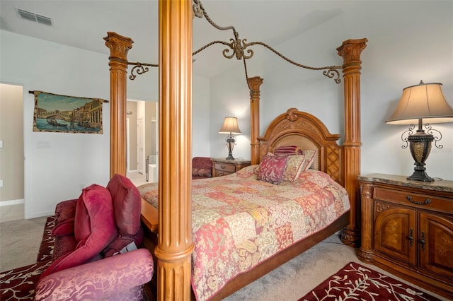 bedroom featuring carpet flooring and decorative columns