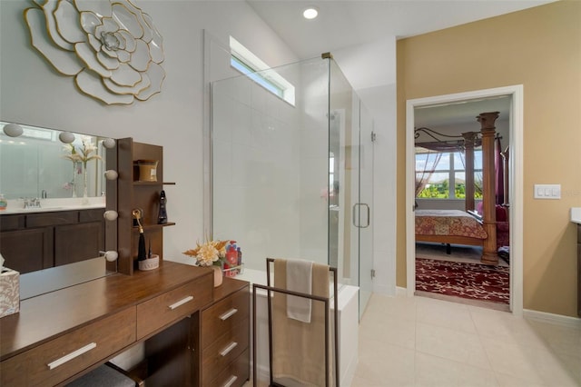 bathroom with tile patterned floors, a shower with door, and vanity