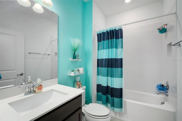 full bathroom featuring vanity, shower / bath combination with curtain, and toilet