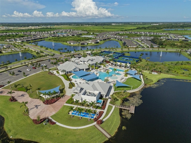 birds eye view of property with a water view