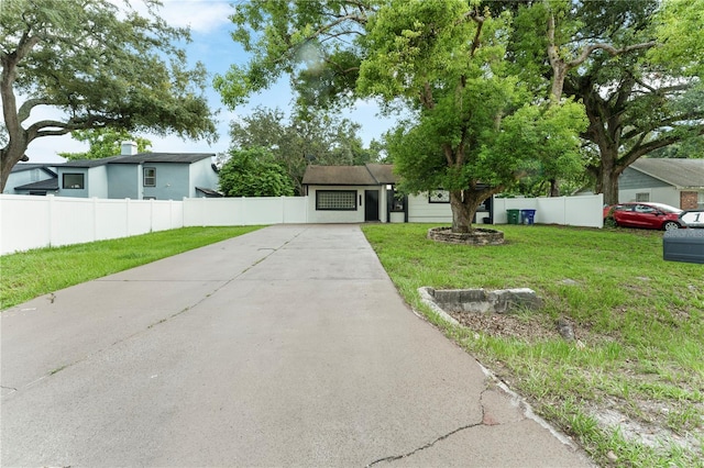 single story home featuring a front yard